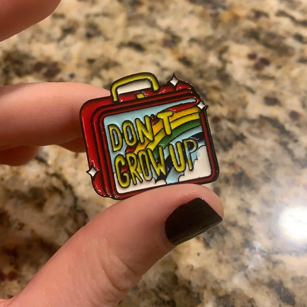 Don’t grow up rainbow pride lunchbox pin
